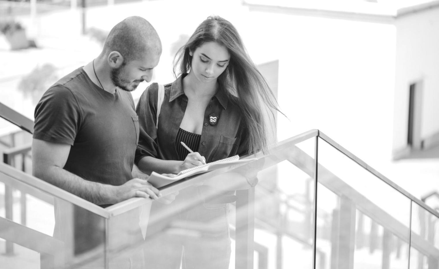 Advanced statistical modeling setup with multiple monitors displaying economic data and trend analysis